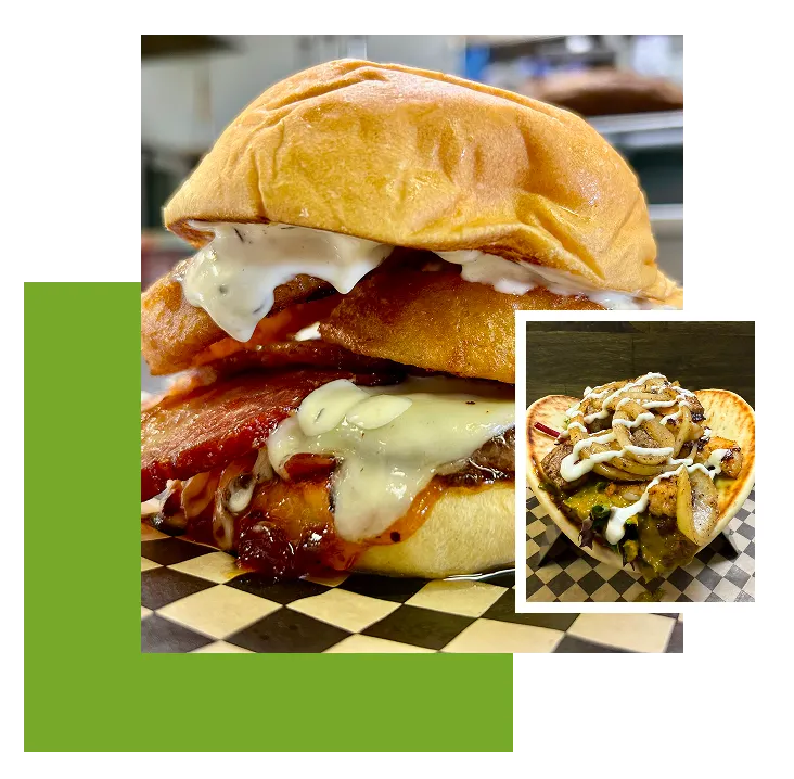 Burger and pizza on checkered surface.