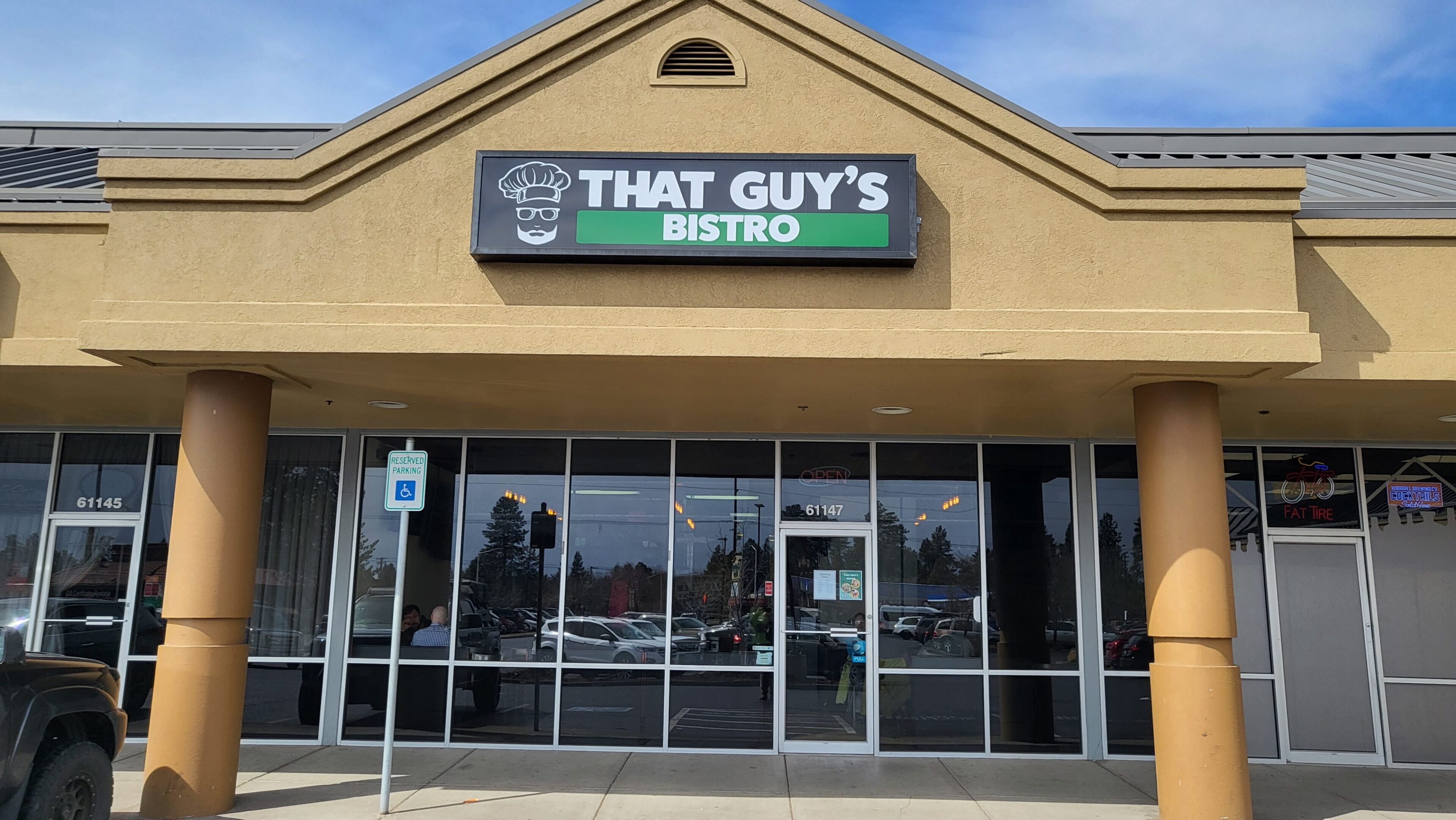 Exterior of That Guy's Bistro with clear signage and glass windows.